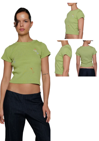 Woman wearing a green t-shirt with color swatches displayed.