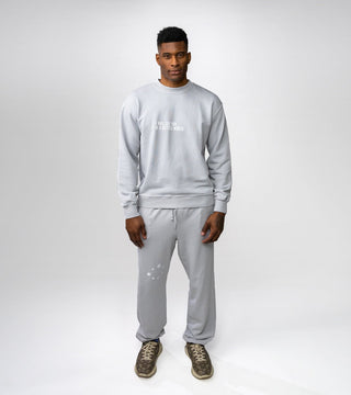 "I will see you in a better world" on front of light grey crewneck and matching light grey sweatpants