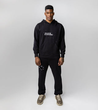 In A Better World set featuring black sweatpants and black hoodie with galaxy inspired designs